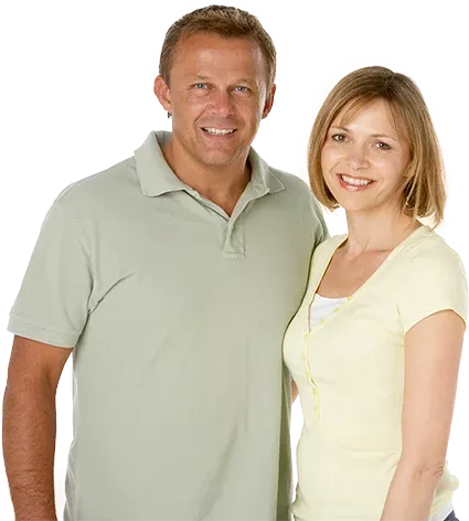 Smiling middle-aged couple standing together, representing wellness and healthy weight management