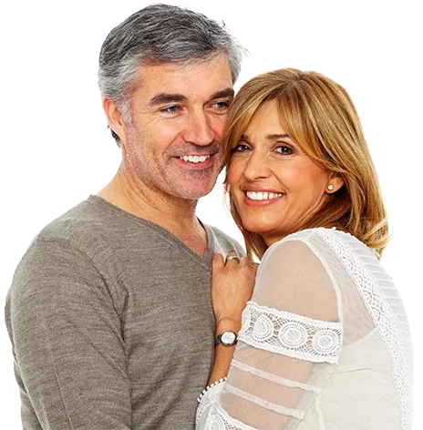 Smiling middle-aged couple embracing, representing wellness and healthy aging